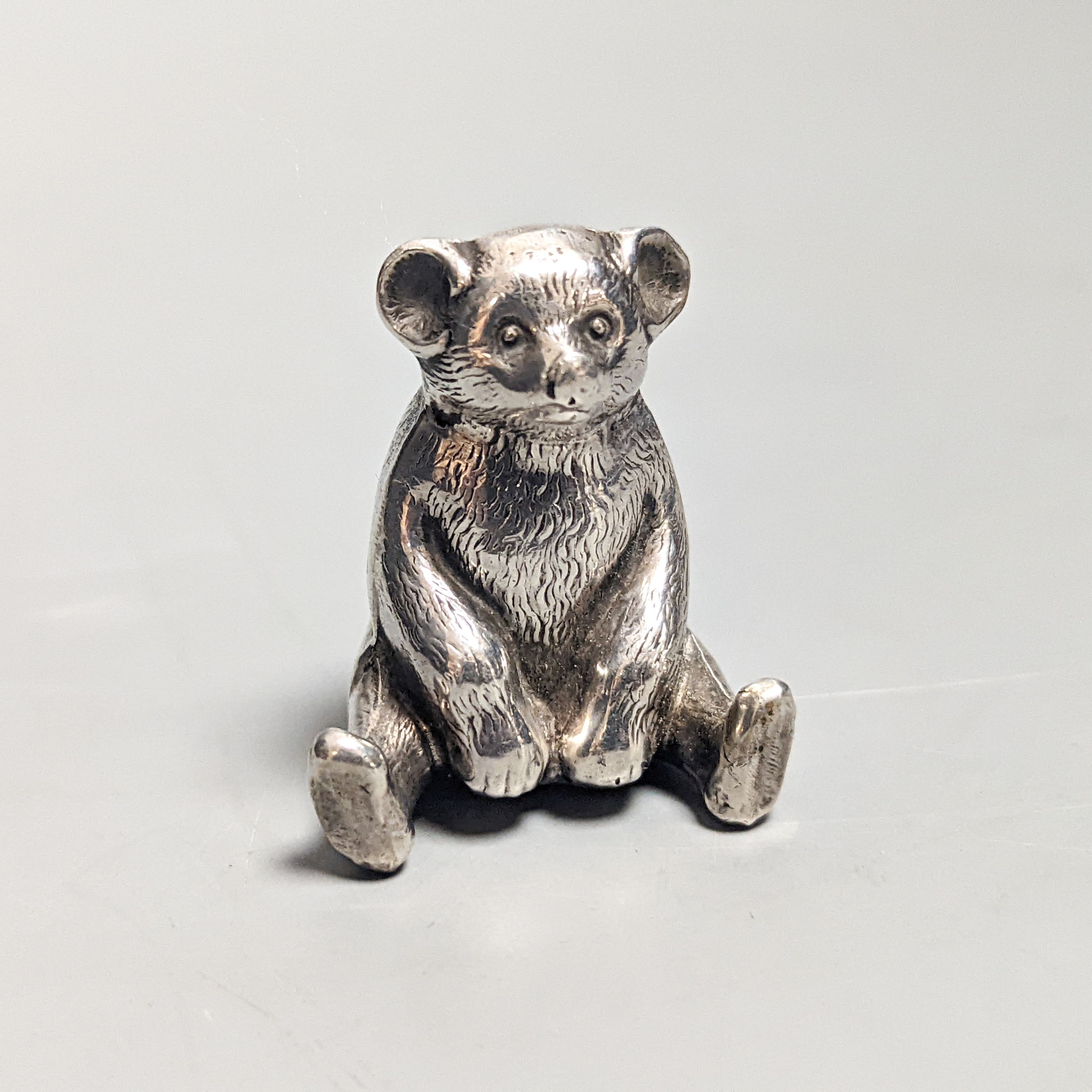 An Edwardian novelty silver 'teddy bear' pin cushion, with later cushion, W.J. Myott & Co, Birmingham, 1909, 36mm.